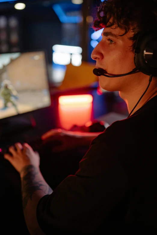 a man wearing headphones playing a video game, in-game, zoomed in, promo image, tournament