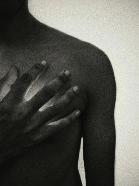 a man with his hands on his chest, an album cover, unsplash, hyperrealism, grainy black-and-white photo, ignant, aida muluneh, scars