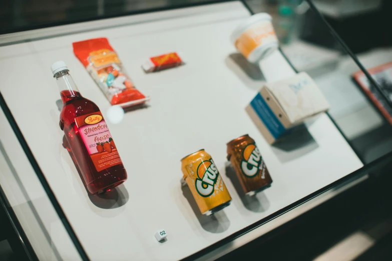 a display case filled with different types of beverages, trending on unsplash, hyperrealism, award-winning crisp details”, 90's photo, thumbnail, high angle close up shot