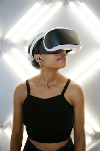 a woman wearing a virtual reality headset, inspired by Kanō Tan'yū, unsplash, afrofuturism, india, wearing a gaming headset, galaxy raytracing, doing an elegant pose