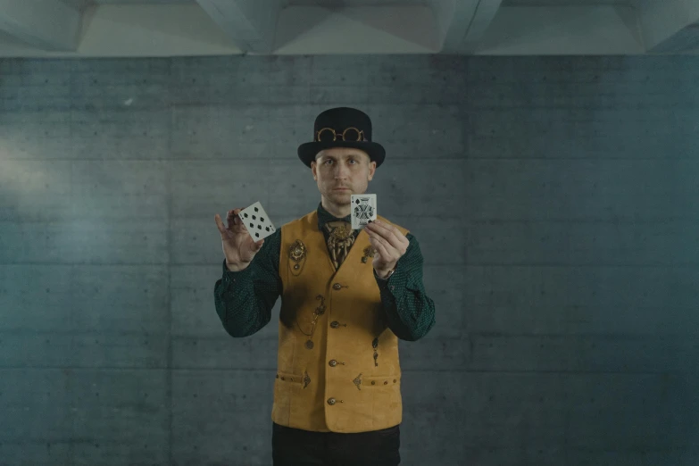 a man in a top hat holding playing cards, a portrait, pexels contest winner, 2 0 2 1 cinematic 4 k framegrab, portrait of tall, symmetrical shot, cardistry