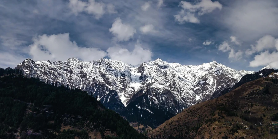 the mountains are covered in snow on a sunny day, an album cover, pexels contest winner, hurufiyya, india, thumbnail, brown, no crop