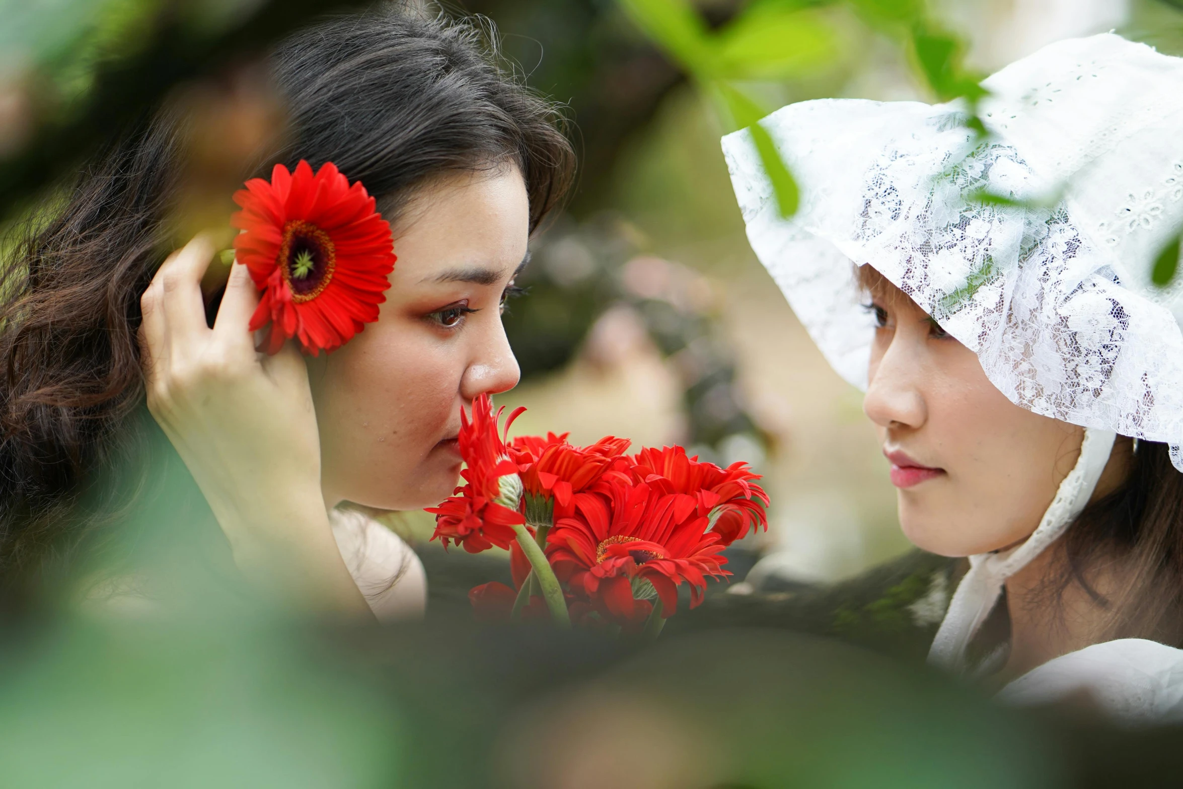 a couple of women standing next to each other holding flowers, inspired by Shin Saimdang, unsplash, romanticism, avatar image, makeup, glimpse of red, still frame from a movie