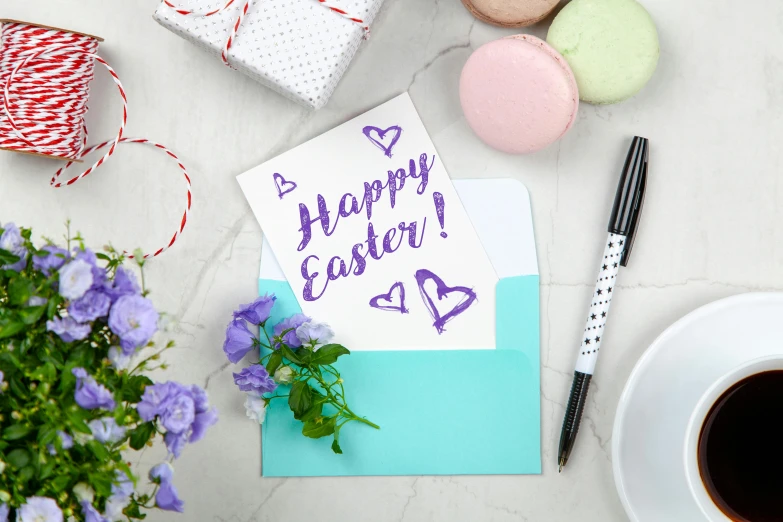 a note sitting on top of a table next to a cup of coffee, holding easter eggs, purple and blue, good at cards, dissection of happy