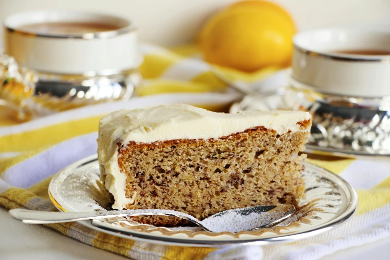 a close up of a piece of cake on a plate, by Lorraine Fox, trending on pixabay, renaissance, with lemon skin texture, banana, tea, manuka