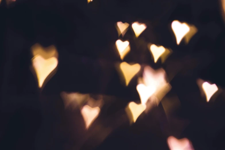 a bunch of lights that are in the dark, by Emma Andijewska, pexels, falling hearts, beautiful soft light, instagram post, starlit