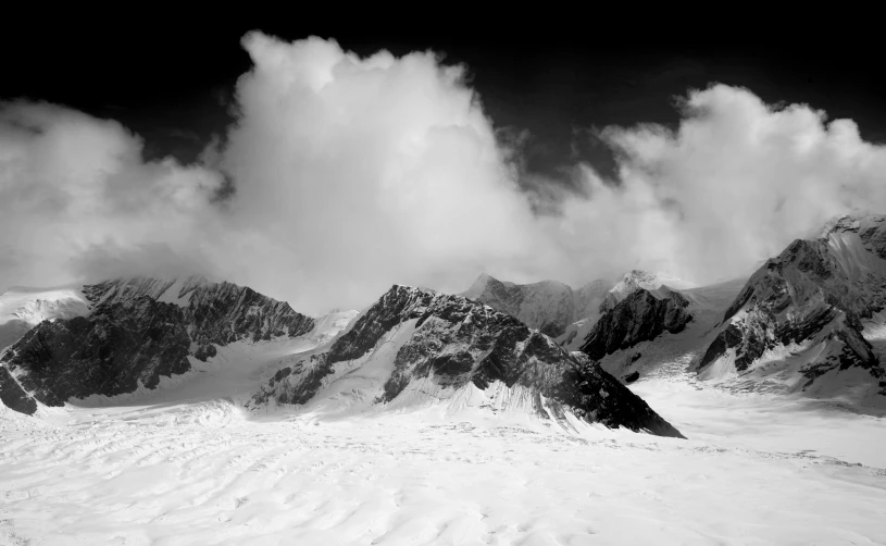 a black and white photo of snow covered mountains, by Andor Basch, detailed medium format photo, dramatic”, dramatic ”, black & white