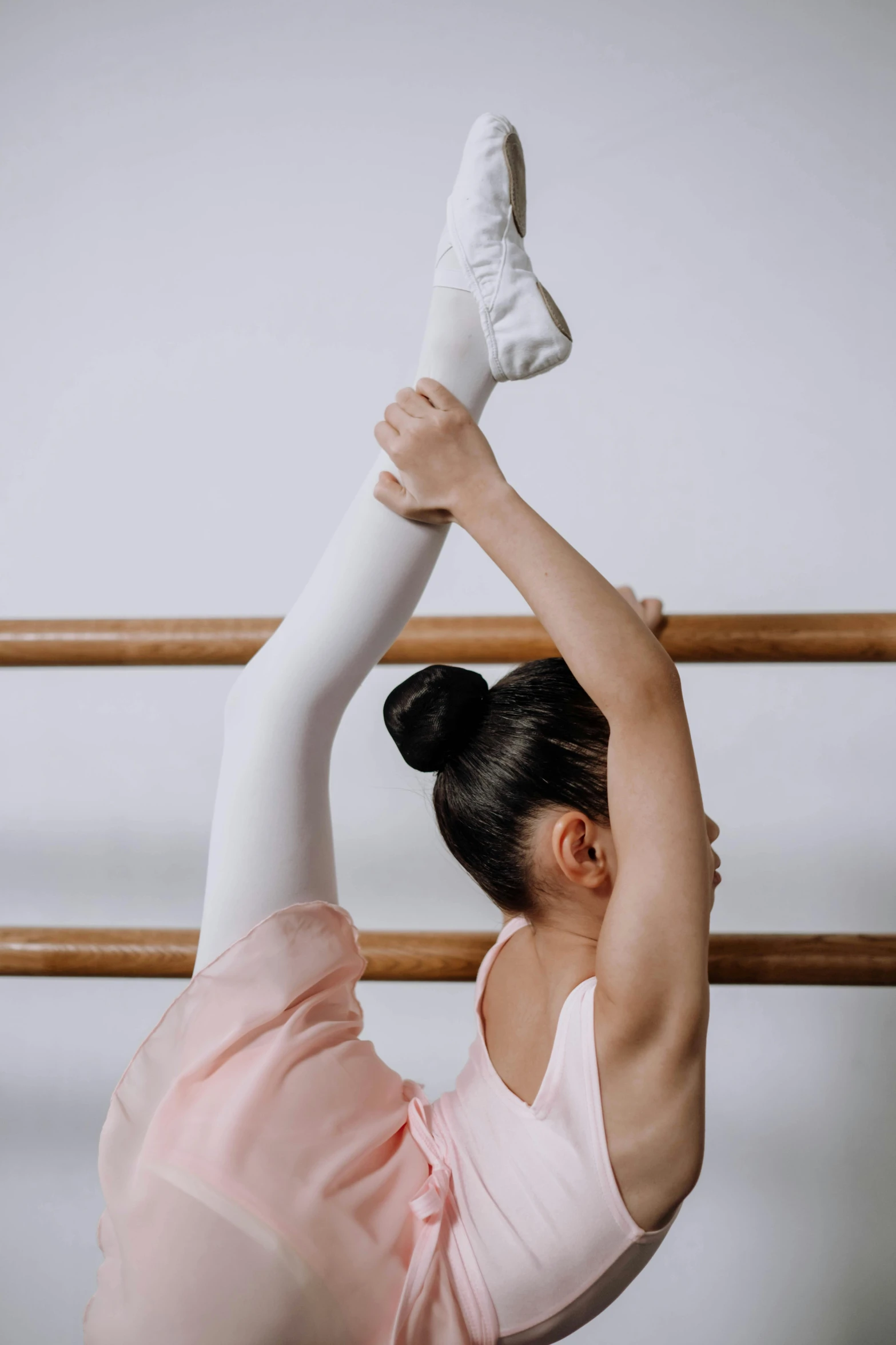 a woman in a pink leo leo leo leo leo leo leo leo leo leo leo leo leo, an album cover, by Elizabeth Durack, pexels contest winner, arabesque, wearing white leotard, children's, ::