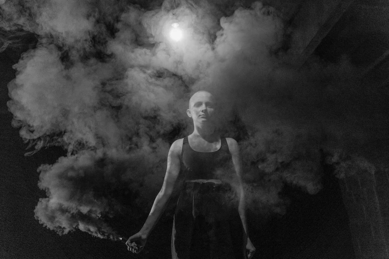 a woman standing in front of a cloud of smoke, a portrait, inspired by Odd Nerdrum, flickr, infared photography, in front of a full moon, skinless head, shaven