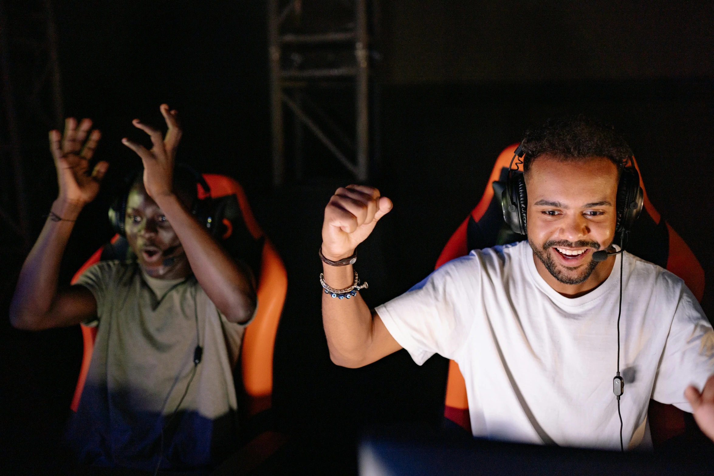 a man wearing headphones sitting in front of a computer, cheering crowds, sierra entertainment games, avatar image, family photo