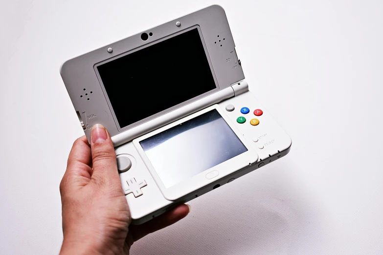 a person holding a nintendo wii game console, a photo, inspired by Akihiko Yoshida, unsplash, neogeo, marble!! (eos 5ds r, high - poly, catalog photo, 2 5 6 x 2 5 6 pixels