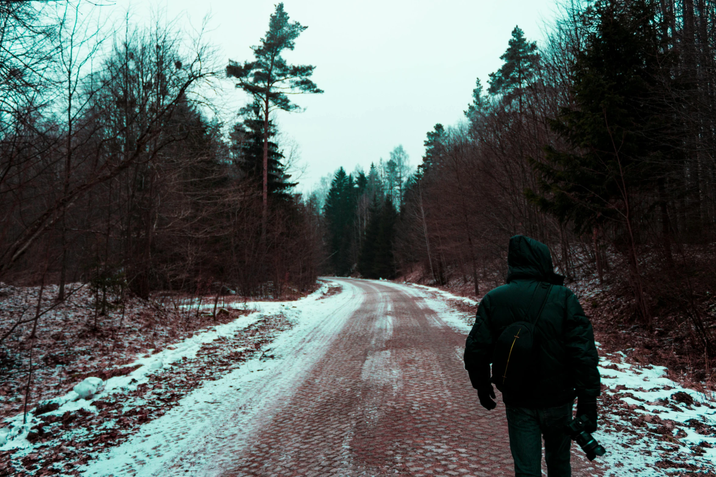 a person walking down a snow covered road, an album cover, pexels contest winner, american astronaut in the forest, ((((dirt brick road)))), sovietwave aesthetic, profile picture 1024px