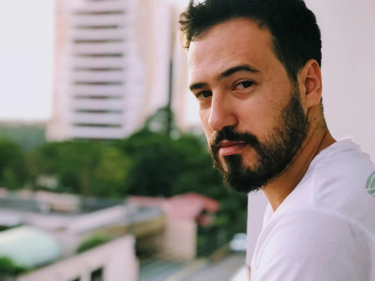 a man with a beard standing on a balcony, inspired by Germán Londoño, pexels contest winner, hyperrealism, a handsome man，black short hair, kuvshinov ilya, despacito, headshot profile picture