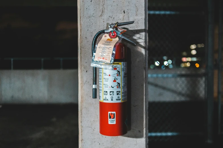 a fire extinguisor attached to the side of a building, a photo, pexels contest winner, orange safety labels, 🦩🪐🐞👩🏻🦳, 35 mm product photo”, full body hero