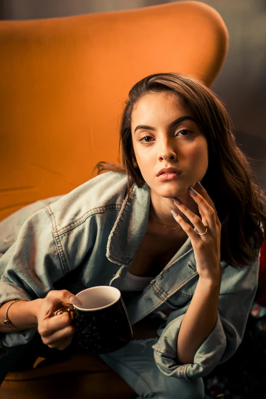 a woman sitting in a chair with a cup of coffee, a portrait, inspired by Elsa Bleda, trending on pexels, isabela moner, kaya scodelario, hand on cheek, 15081959 21121991 01012000 4k