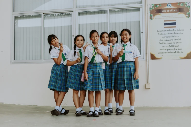 a group of young girls standing next to each other, a picture, pexels contest winner, vancouver school, avatar image, school uniform, nivanh chanthara, background image