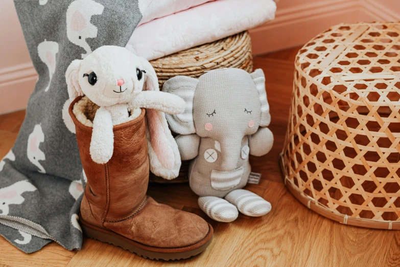 a pile of stuffed animals sitting on top of a wooden floor, a picture, boots, high quality product image”, eucalyptus, elephant