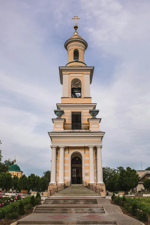 a tall tower with a clock on top of it, inspired by Illarion Pryanishnikov, baroque, exterior botanical garden, medium-shot, square, churches