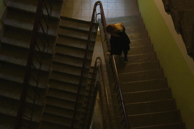 a person walking down a flight of stairs, inspired by Elsa Bleda, realism, b - roll, anna nikonova, destitute, high school