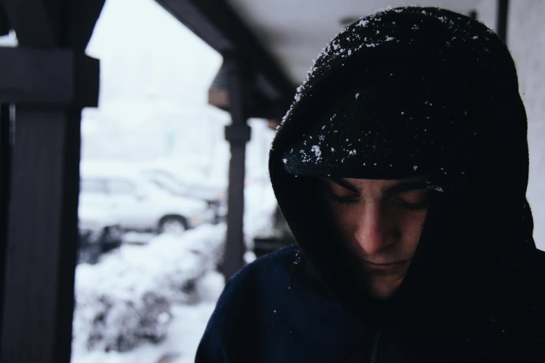 a close up of a person wearing a hoodie, pexels contest winner, snowstorm ::5, portrait of depressed teen, background image, thin young male