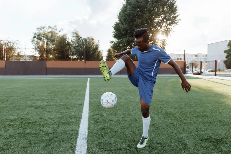 a person kicking a soccer ball on a field, ( ( dark skin ) ), compression, 15081959 21121991 01012000 4k, posed