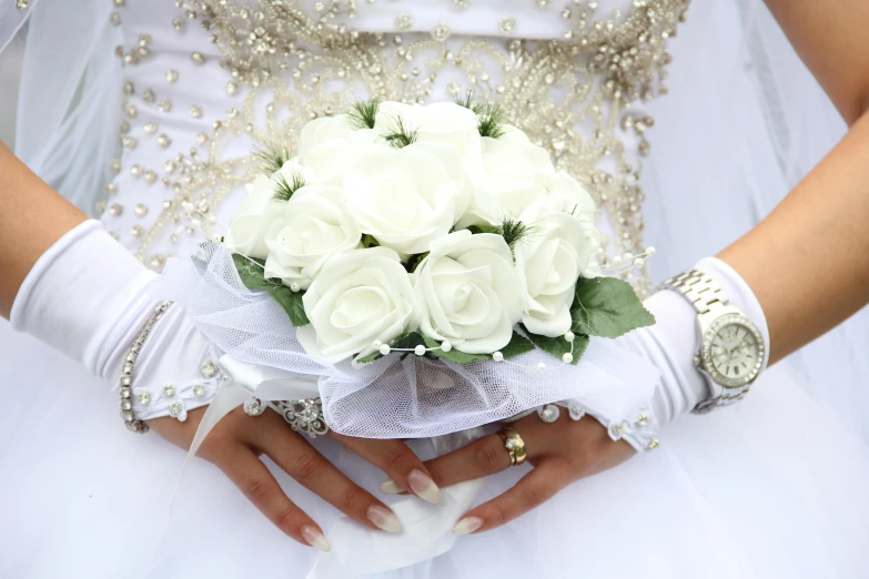 a bride holding a bouquet of white roses, by Arthur Sarkissian, pixabay, islamic, floral bling, instagram picture, hispanic