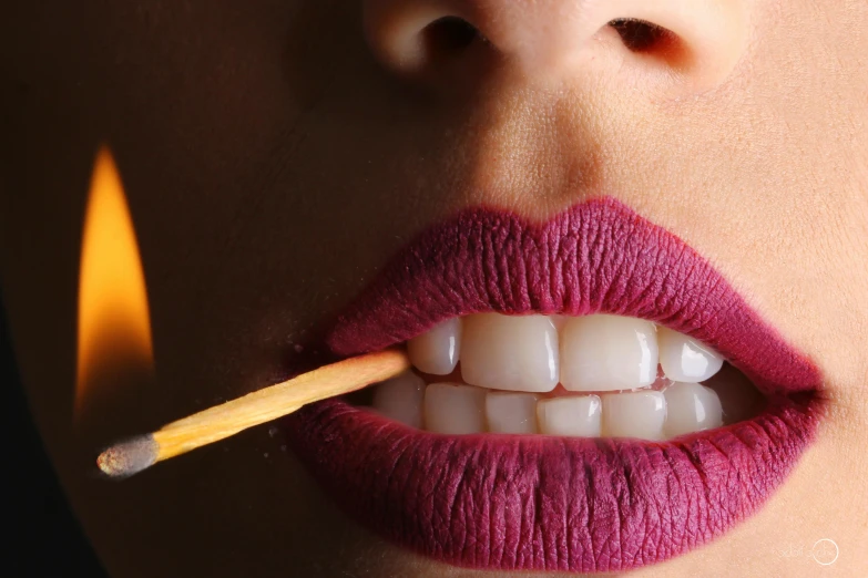 a close up of a person with a matchstick in their mouth, inspired by Bert Stern, trending on pexels, hyperrealism, purple lipstick, beauty geisha, brushes her teeth, sexy lips :5 stylish