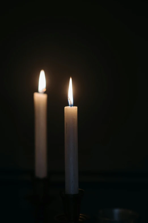 two white candles are lit in the dark, on a gray background, ap news, 15081959 21121991 01012000 4k, instagram photo