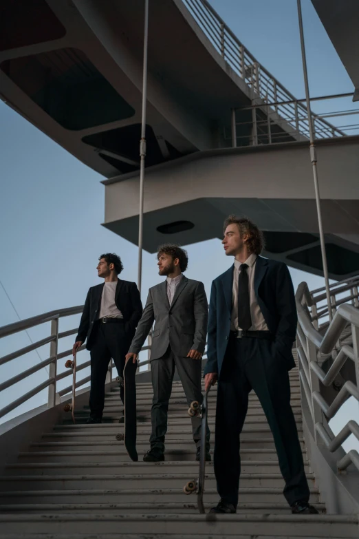 a group of men standing on top of a bridge, an album cover, by Niko Henrichon, pexels contest winner, in a suit, three quarter shot, wavy, serious business