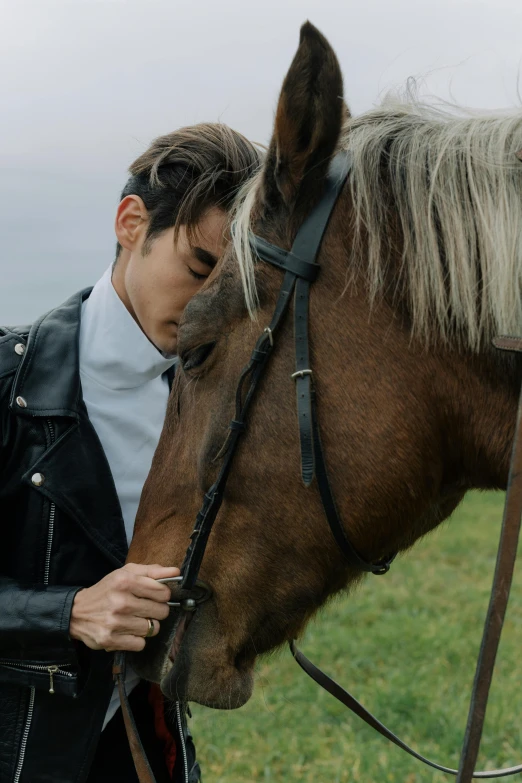 a man standing next to a horse in a field, an album cover, trending on pexels, romanticism, avan jogia angel, masculine jawline!, male ulzzang, profile image