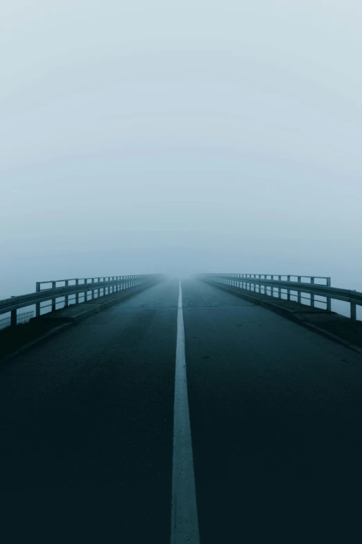 a long road on a foggy day, an album cover, by Holger Roed, unsplash, postminimalism, 2 5 6 x 2 5 6 pixels, on a bridge, blue, 15081959 21121991 01012000 4k