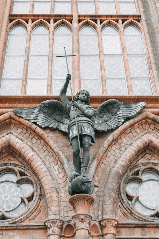 a statue of an angel on top of a building, holding a sword and shield, standing inside of a church, 🚿🗝📝, multiple stories