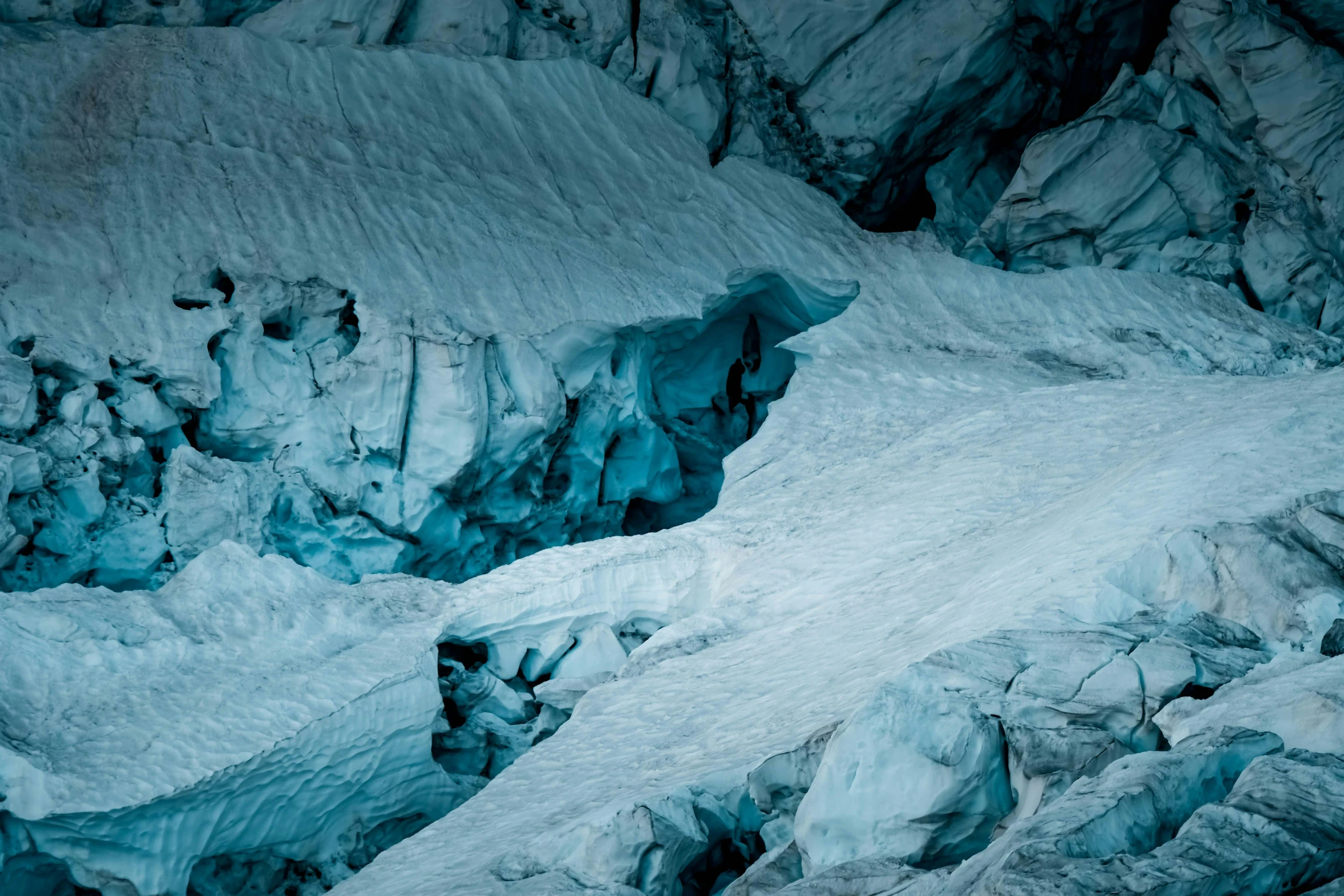 a group of people standing on top of a snow covered mountain, pexels contest winner, process art, blue glacier, cold texture, panels, snow cave