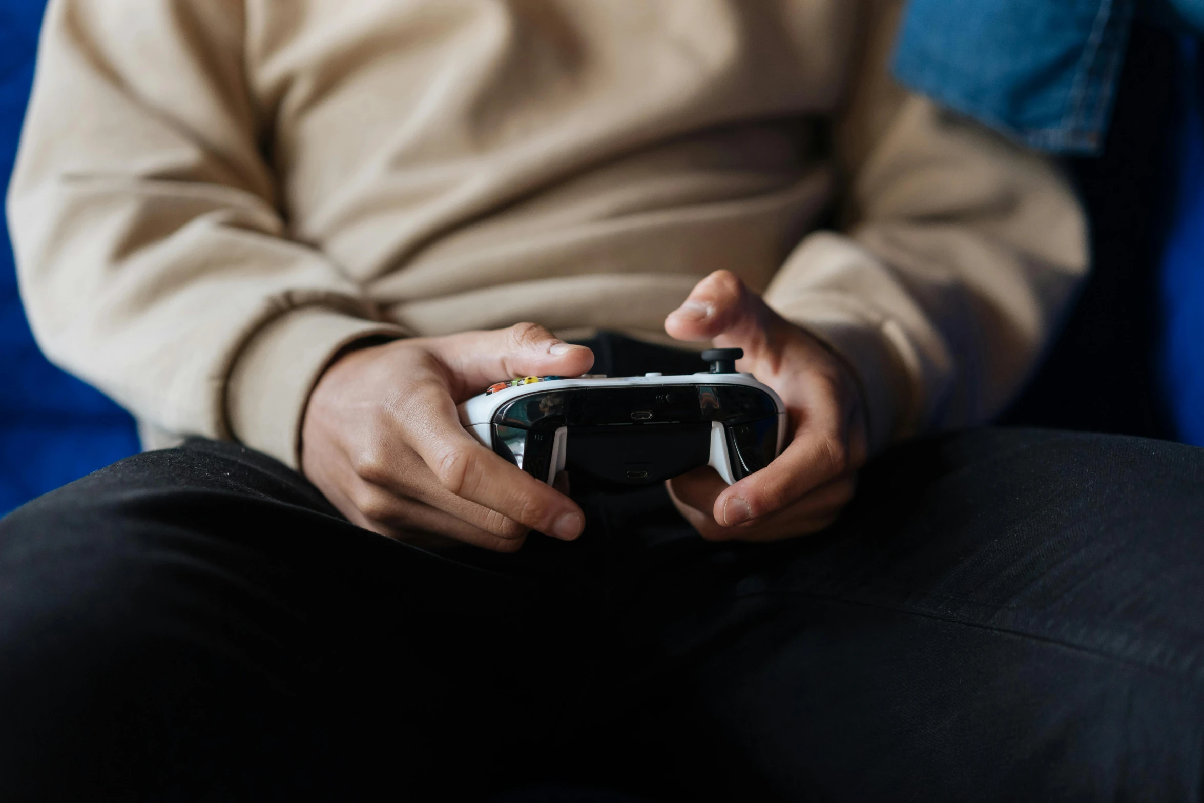 a man holding a video game controller in his hands, unsplash, avatar image