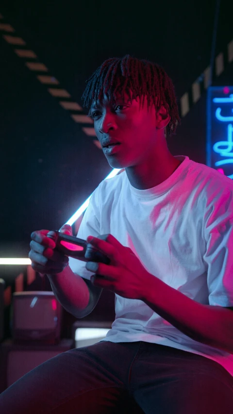 a young man is playing a video game, inspired by Liam Wong, pexels, realism, trippie redd, handsome hip hop young black man, nightlife, sports photo