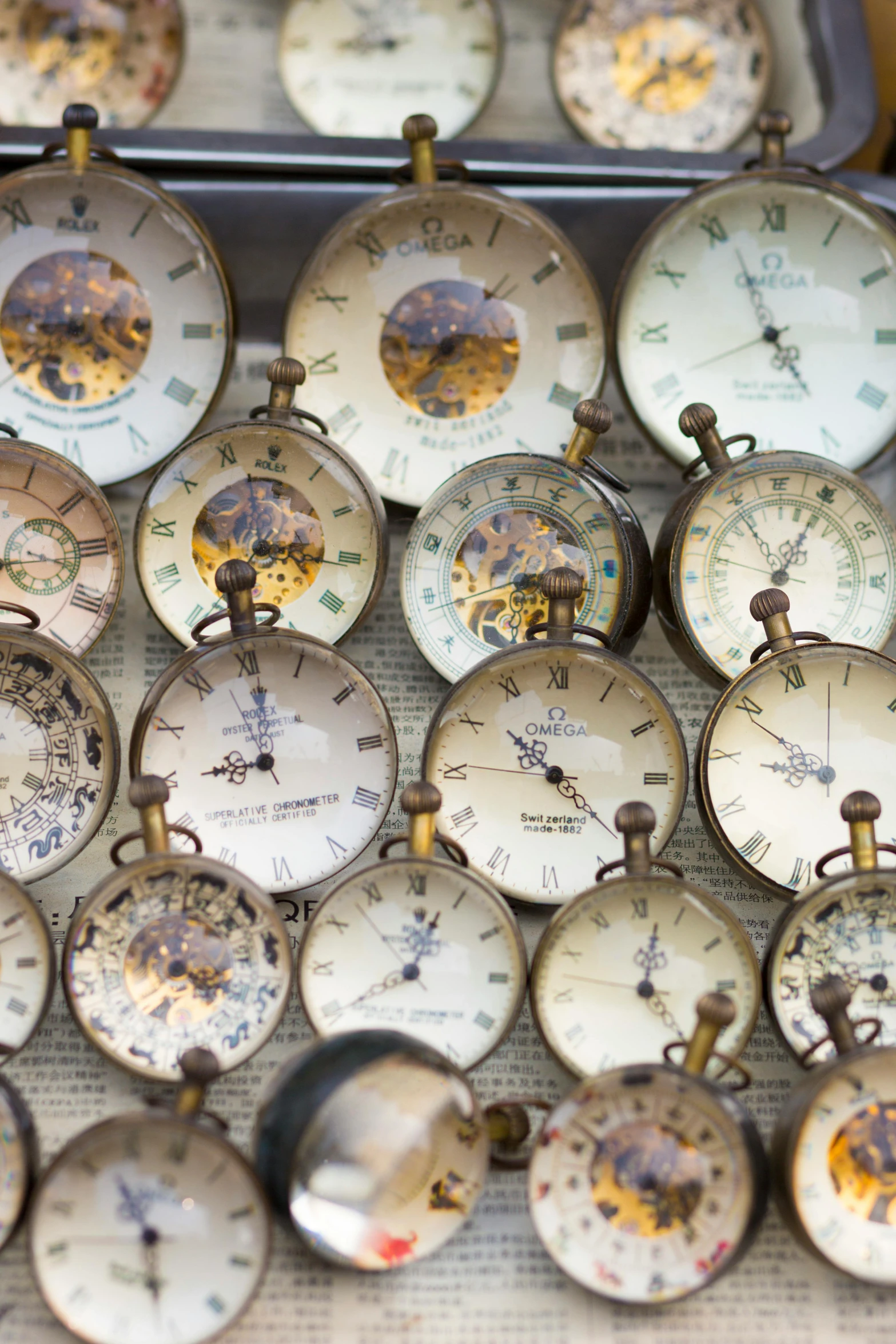 a bunch of clocks sitting on top of a table, thumbnail, vintage inspired, mechanical, multiple stories