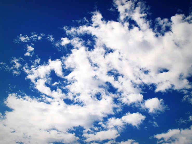 a person is flying a kite in the sky, “puffy cloudscape, deep blue sky, computer wallpaper, instagram photo