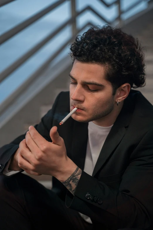 a man in a suit smoking a cigarette, an album cover, inspired by Elsa Bleda, pexels contest winner, pete davidson, young handsome pale roma, joe keery, trending photo