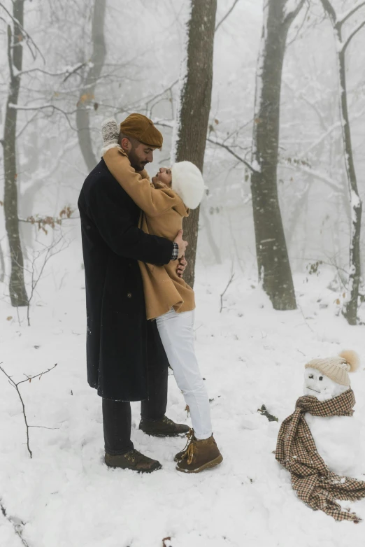 a man and a woman hugging in the snow, pexels contest winner, in a whimsical fairytale forest, gif, belgium, slide show