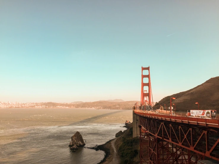 a view of the golden gate bridge in san francisco, california, pexels contest winner, pink marble building, brown, high view, slide show