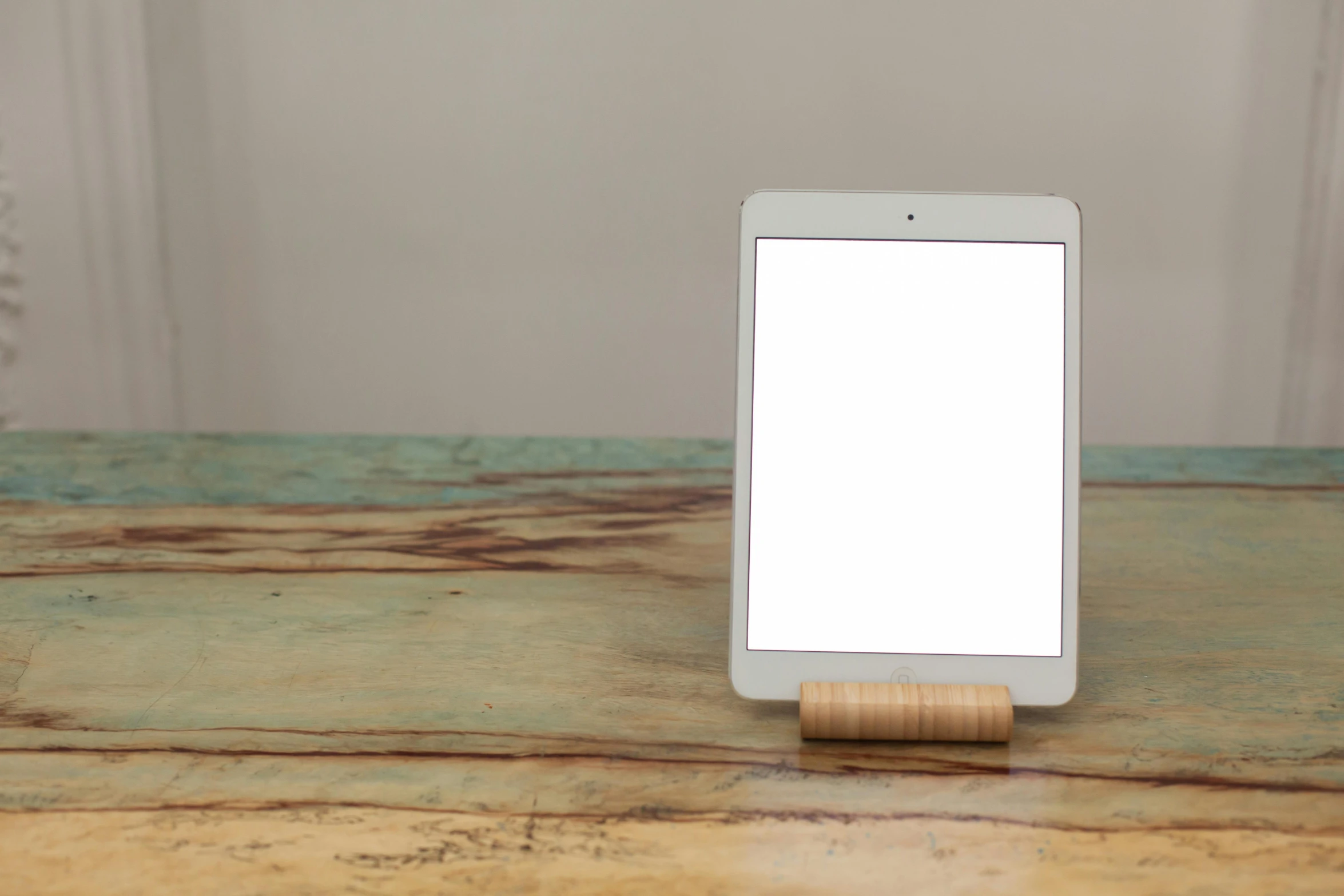 a tablet computer sitting on top of a wooden table, unsplash, modernism, square, with a whitish, product lighting. 4 k, front portrait