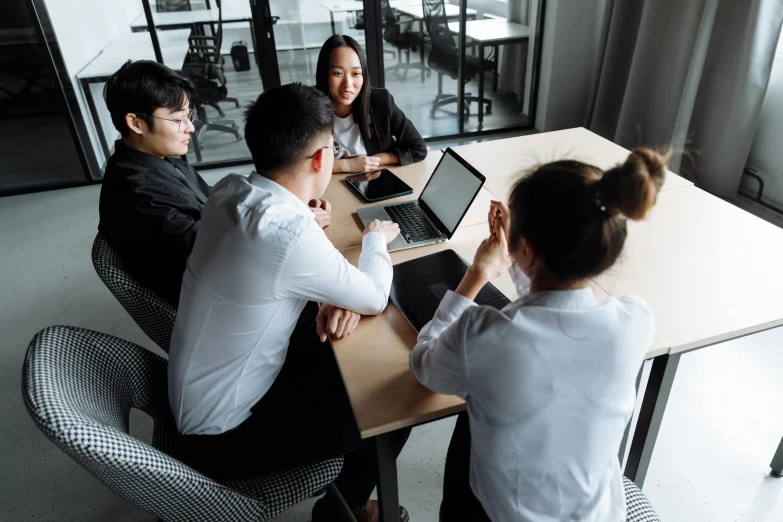 a group of people sitting around a table with laptops, pexels contest winner, te pae, cubical meeting room office, asian descend, thumbnail