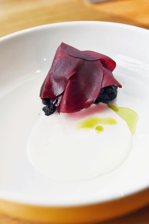 a close up of a plate of food on a table, inspired by Antonio Rotta, squashed berry stains, datura, duck, cloth