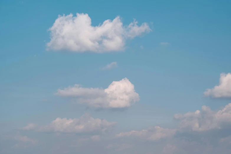 a man flying a kite on top of a lush green field, inspired by Elsa Bleda, unsplash, postminimalism, giant cumulonimbus cloud, archival pigment print, light blue sky with clouds, clemens ascher