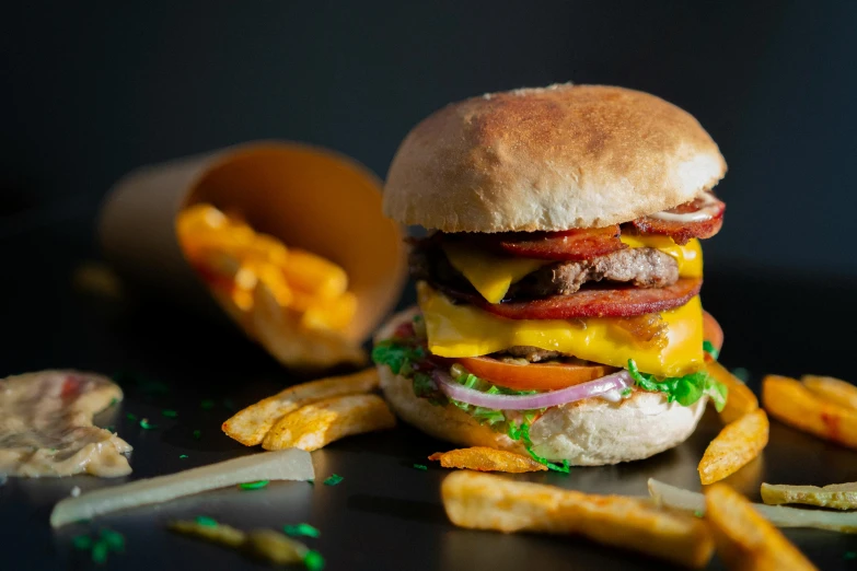 a hamburger and french fries on a table, pexels contest winner, hyperrealism, on black background, 🦩🪐🐞👩🏻🦳, melted cheddar, profile photo