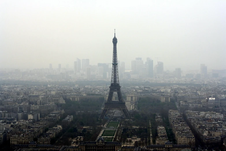 a view of the eiffel tower from the top of the eiffel tower, pexels contest winner, paris school, industrial fires and smog, under a gray foggy sky, hyper realistic ”, ap