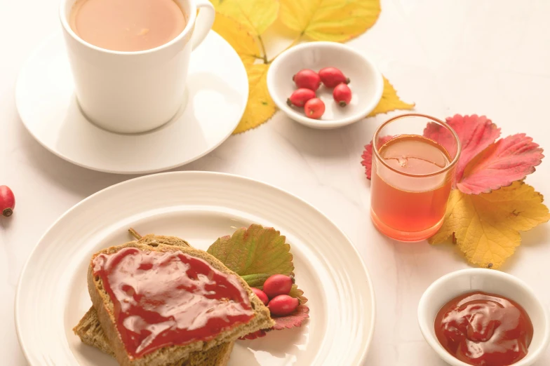 a white plate topped with a piece of bread next to a cup of tea, pink and red color scheme, maple syrup, thumbnail, breakfast buffet