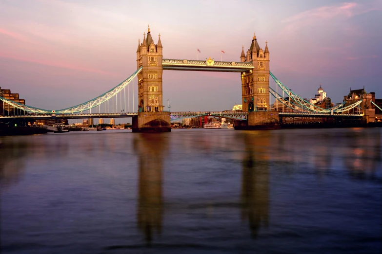 a bridge spanning over a body of water, an album cover, inspired by Thomas Struth, pexels contest winner, tower bridge, pink golden hour, medium format, 8k resolution”