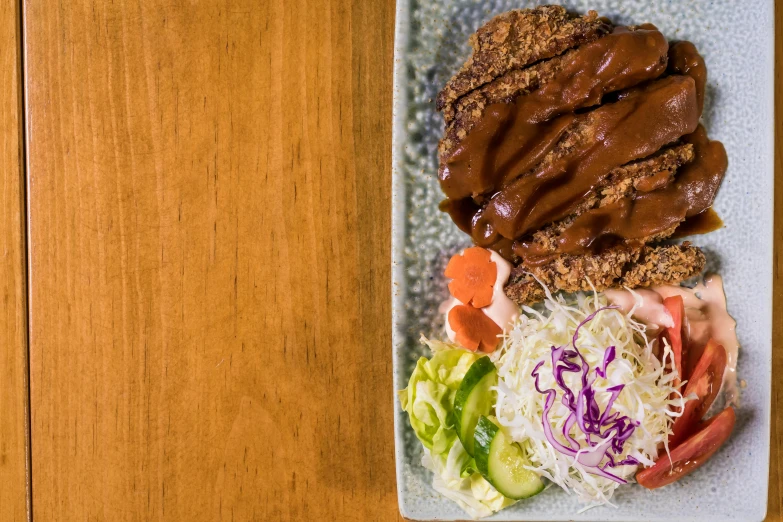 a close up of a plate of food on a table, a picture, unsplash, sōsaku hanga, meatloaf, square, thumbnail, brown sauce