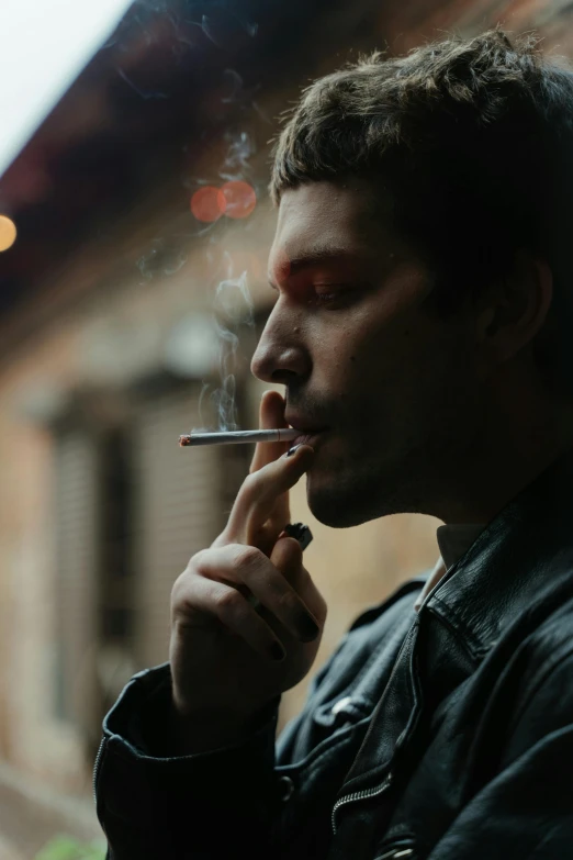 a man smoking a cigarette in front of a window, inspired by Elsa Bleda, pexels contest winner, gopnik in a black leather jacket, dustin lefevre, ethan klein, outside alone smoking weed